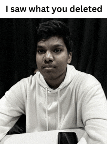 a black and white photo of a young man with a caption that says i saw what you deleted