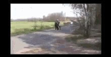 a blurry picture of a person walking down a path