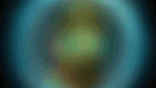 a blurred image of a person in a blue circle on a dark background