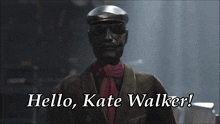 a man wearing a hat and scarf with the words hello kate walker written below him