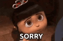 a little girl from despicable me is holding a piece of paper and saying sorry .