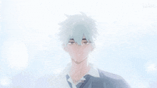 a blurry picture of a boy with chinese writing on the bottom right