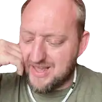 a man with a beard is making a funny face with his hand to his face