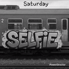 a train with graffiti on it that says saturday