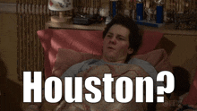 a man is laying in bed with the word houston written on the bottom