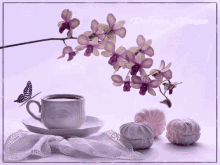 a cup of coffee sits on a saucer next to flowers and a butterfly