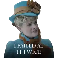 a woman wearing a blue hat and a scarf says i failed at it twice