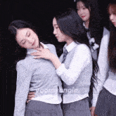 a group of girls standing next to each other with the word yoomyangie on the bottom left
