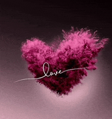 a pink heart made of smoke with the word love written on it .