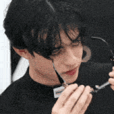 a man wearing a black shirt that says stay