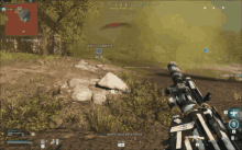 a screenshot of a video game shows a person holding a sniper rifle in a field