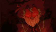 a glowing heart with teeth and a cross on the eyes