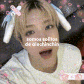 a person with bunny ears on their head and the words somos solitos de alechinchin on their face