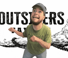 a man wearing a green shirt with thrasher on it