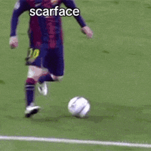 two soccer players are playing a game of soccer and one of them is wearing a scarface shirt .