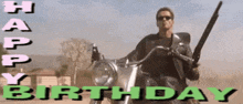 a man riding a motorcycle with a gun and the words happy birthday