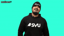 a man with a beard wears a black hoodie that says svu
