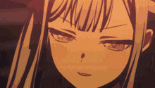 a close up of a girl 's face with a slight smile on her face