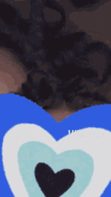 a picture of a person 's hair and a blue heart with the words i 'm & i 'm on it