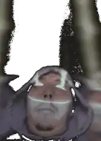 a man with a hood on his head is looking up at something