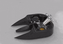 a close up of a black object with a sticker on it that says ' stainless steel '