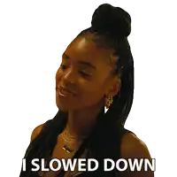 a woman with braids says i slowed down on a white background