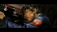 a man wearing a blue jacket with effective security systems written on the sleeve