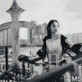 a black and white photo of a woman in armor with the letters ms visible