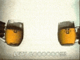 two mugs of beer are being poured into each other and the words let 's gooooo !!! are visible .