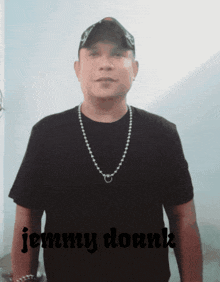 a man wearing a black shirt with jenny dounk written on the bottom right