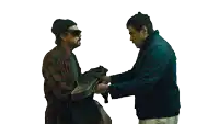 a man in a plaid shirt is looking at a guitar case