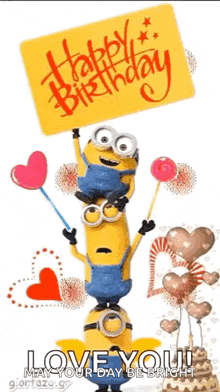 a stack of minions holding balloons and a sign that says `` happy birthday `` .