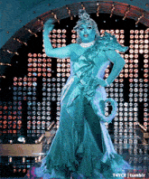 a drag queen in a statue of liberty costume