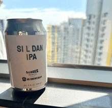 a can of si l dan ipa sits on a table