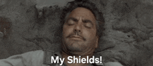 a man with his hands behind his head and the words my shields above him
