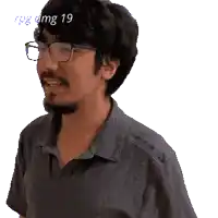 a man wearing glasses and a shirt that says mg 19 on the top