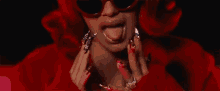 Tongue Out Shades On GIF - Tongue Out Shades On Lady In Red GIFs