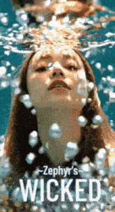 a poster for zephyr 's wicked showing a woman underwater
