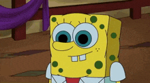 a close up of a cartoon character named spongebob with blue eyes