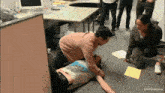 a man is laying on the floor with a dvd film bonus watermark