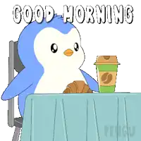 a penguin is sitting at a table with a cup of coffee and a croissant and says good morning