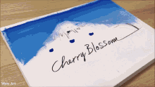 a painting with cherry blossom written on the bottom
