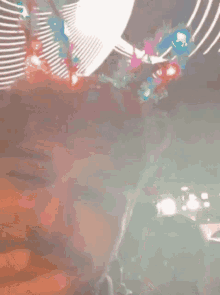 a close up of a person 's face with a bunch of lights behind them