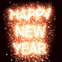 the word happy is made of sparklers on a black background