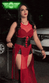 a woman in a red dress is holding a suitcase in front of a sign that says wingstop