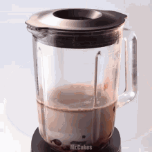 a blender with the word mr.cakes on the bottom
