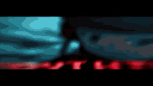 a blurred image of a person wearing sunglasses and a red background .