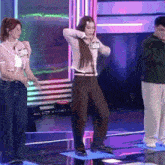 a woman is dancing on a stage with a name tag that says berd