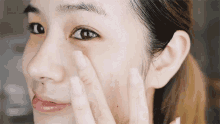 Checking Skin Kim Dao GIF - Checking Skin Kim Dao Tapping Face GIFs