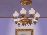 a chandelier is hanging from the ceiling above a picture